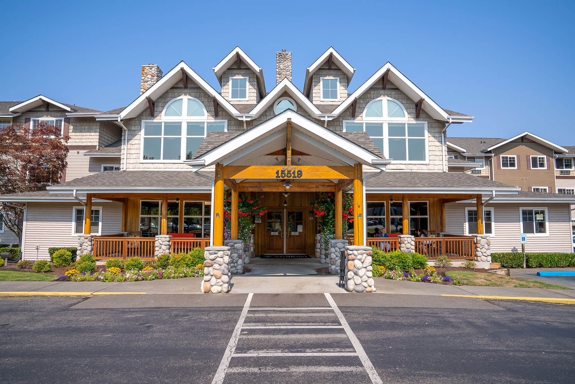 Stafford Suites in Sumner A charming building with large windows and a wooden entrance