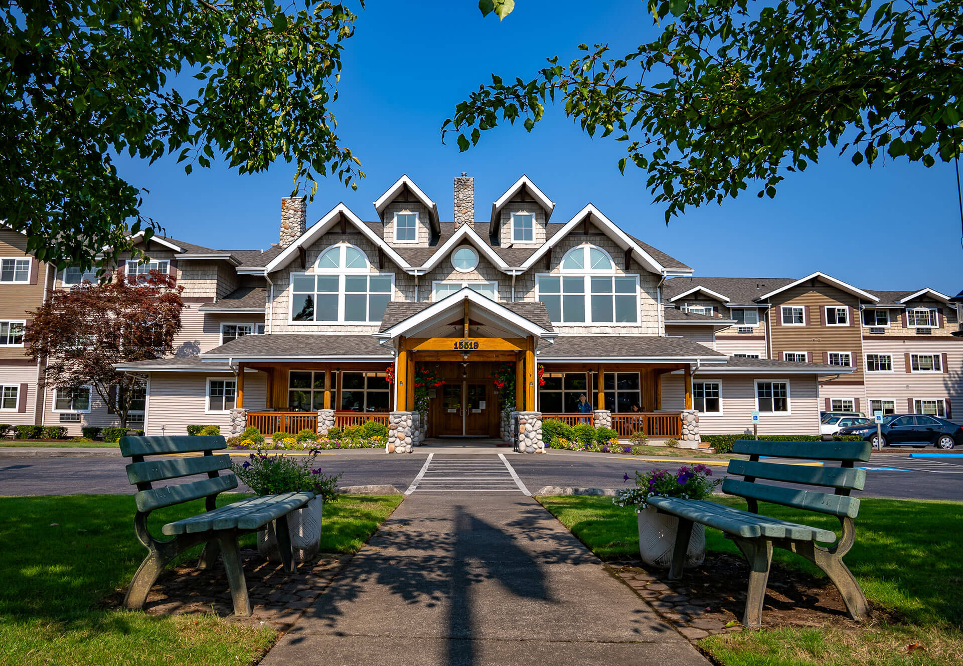 Stafford Suites in Sumner A charming building with large windows and a wooden entrance